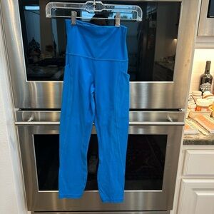 Authentic Lululemon Athletica Blue leggings, size 2. Has stains.